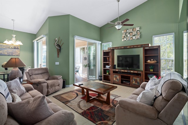 1101 Royal Troon Ln, Saint Augustine, FL 32086 - living room featuring tile patterned floors, high vaulted ceiling, baseboards, and ceiling fan with notable chandelier