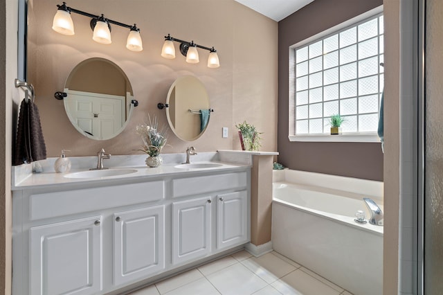 1101 Royal Troon Ln, Saint Augustine, FL 32086 - bathroom with tile patterned flooring, a sink, double vanity, and a garden tub