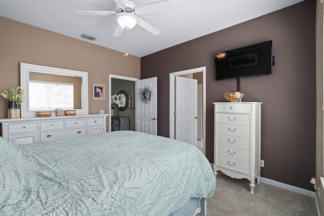 1101 Royal Troon Ln, Saint Augustine, FL 32086 - bedroom with light colored carpet, visible vents, ceiling fan, and baseboards