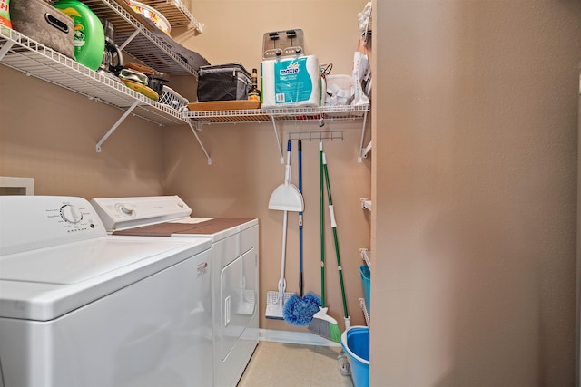 1101 Royal Troon Ln, Saint Augustine, FL 32086 - clothes washing area with light tile patterned flooring, washing machine and dryer, and laundry area