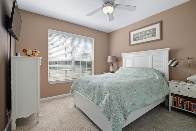 1101 Royal Troon Ln, Saint Augustine, FL 32086 - bedroom featuring light carpet, baseboards, and a ceiling fan