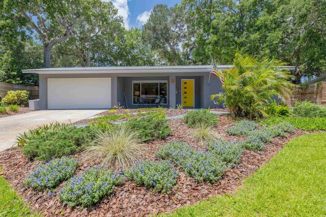16 Oak Rd, Saint Augustine, FL 32080 - view of front facade with a garage, stucco siding, and driveway