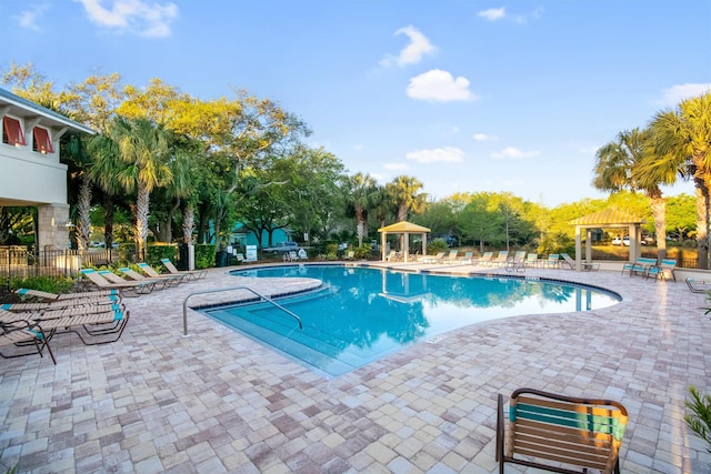 view of swimming pool with a gazebo and a patio