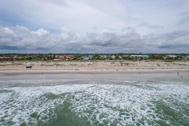 bird's eye view featuring a view of the beach and a water view