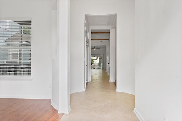 hallway with light hardwood / wood-style flooring