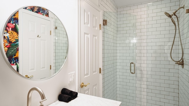 full bathroom featuring a sink and a shower stall