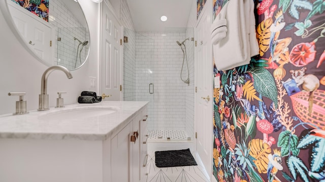 full bath featuring a stall shower and vanity