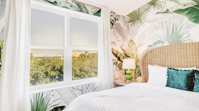 bedroom featuring wallpapered walls