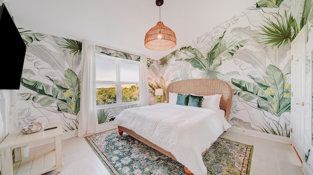 bedroom featuring wallpapered walls and light tile patterned floors