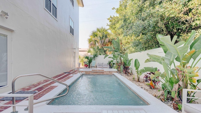 view of pool with a fenced backyard and a fenced in pool