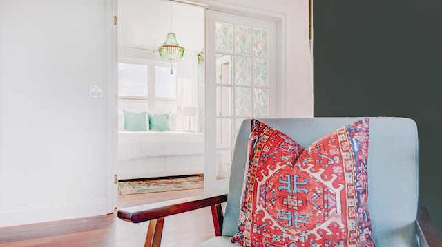 sitting room with wood finished floors and baseboards