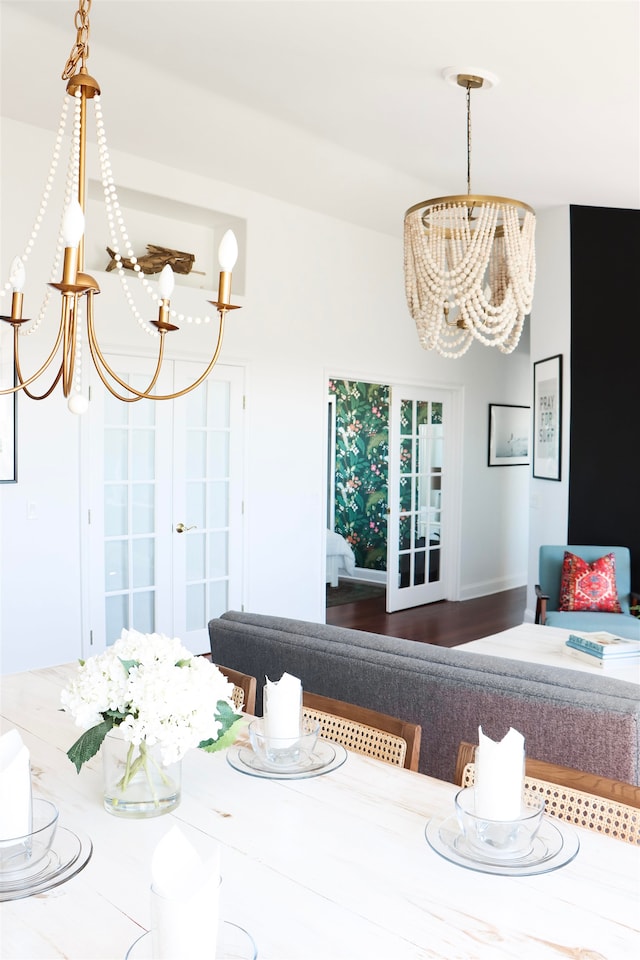 dining room with a chandelier and wood finished floors