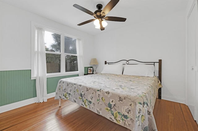 bedroom featuring hardwood / wood-style floors and ceiling fan