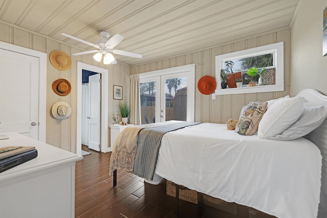 bedroom with access to exterior, ceiling fan, dark hardwood / wood-style flooring, and wooden ceiling