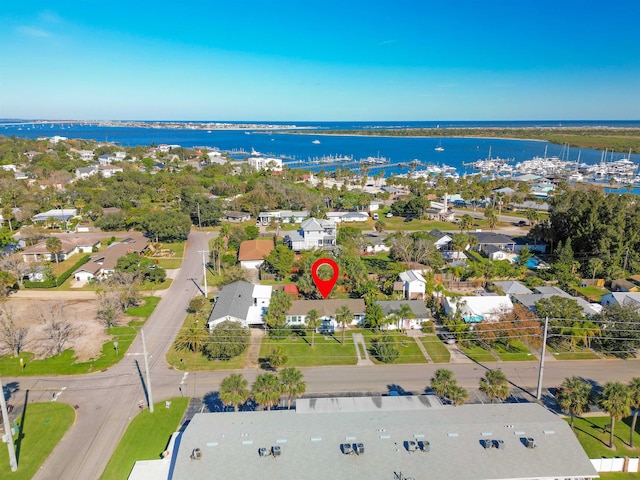 birds eye view of property featuring a water view