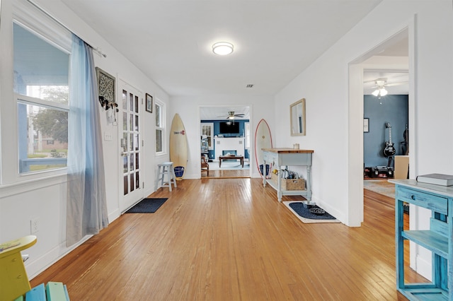 corridor featuring hardwood / wood-style floors