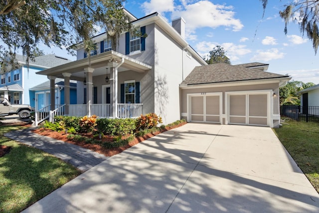 view of front of home featuring a garage and covered porch