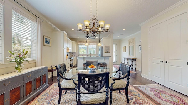 dining room with recessed lighting, baseboards, dark wood-style floors, and crown molding