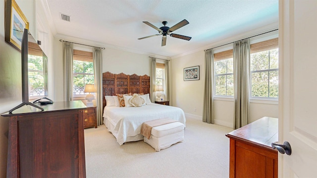 bedroom with light carpet, visible vents, baseboards, and ornamental molding