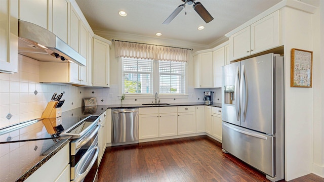 kitchen with ventilation hood, dark wood-style flooring, a sink, decorative backsplash, and stainless steel appliances