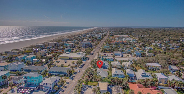 drone / aerial view with a residential view, a beach view, and a water view