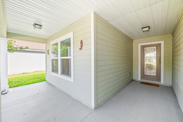 doorway to property featuring a porch