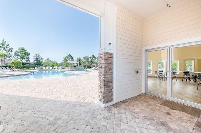 community pool with a patio