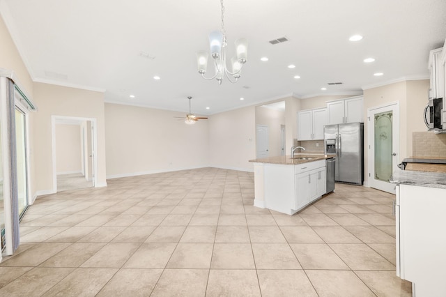 kitchen with appliances with stainless steel finishes, crown molding, a sink, recessed lighting, and ceiling fan