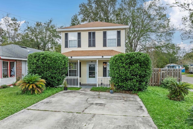 view of front facade with covered porch and a front yard