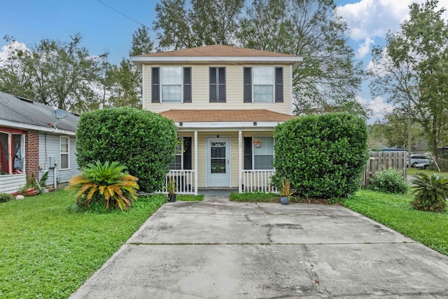 view of front of house with a porch and a front yard