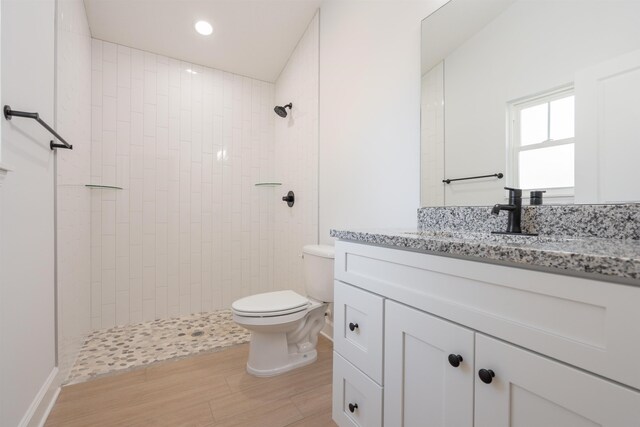 237 Jackson Blvd, Saint Augustine, FL 32095 - bathroom featuring vanity, recessed lighting, toilet, tiled shower, and wood finished floors