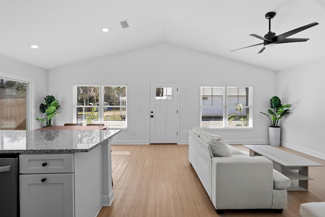 237 Jackson Blvd, Saint Augustine, FL 32095 - living room with vaulted ceiling, baseboards, light wood finished floors, visible vents, and a ceiling fan