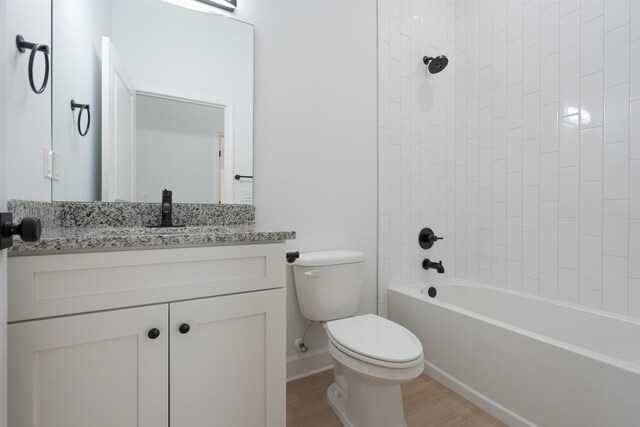 237 Jackson Blvd, Saint Augustine, FL 32095 - bathroom featuring toilet, vanity, wood finished floors, baseboards, and tub / shower combination