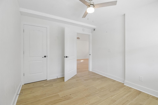 155 Drake Rd, Saint Augustine, FL 32086 - unfurnished bedroom featuring baseboards, light wood finished floors, and a ceiling fan