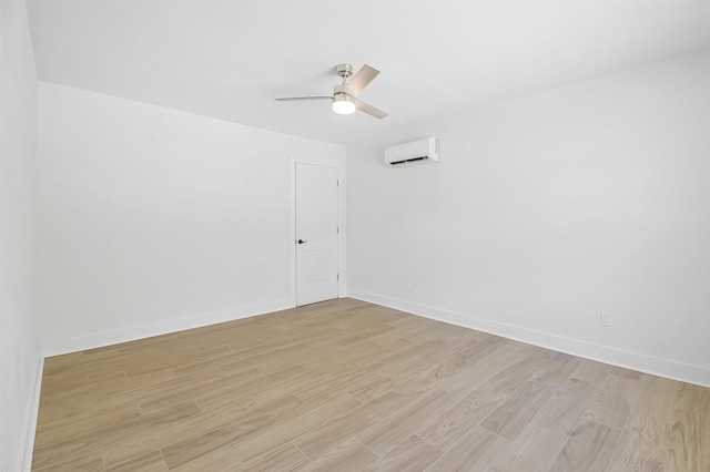 155 Drake Rd, Saint Augustine, FL 32086 - unfurnished room with light wood-style floors, an AC wall unit, a ceiling fan, and baseboards