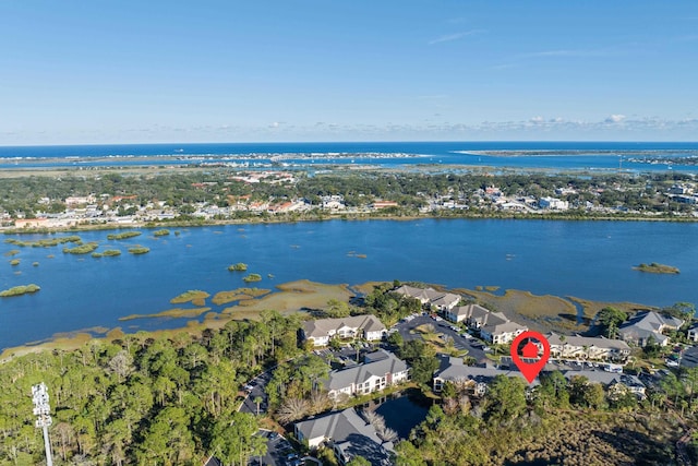 drone / aerial view featuring a water view and a residential view