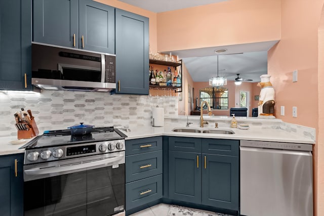 kitchen with tasteful backsplash, appliances with stainless steel finishes, light countertops, open shelves, and a sink