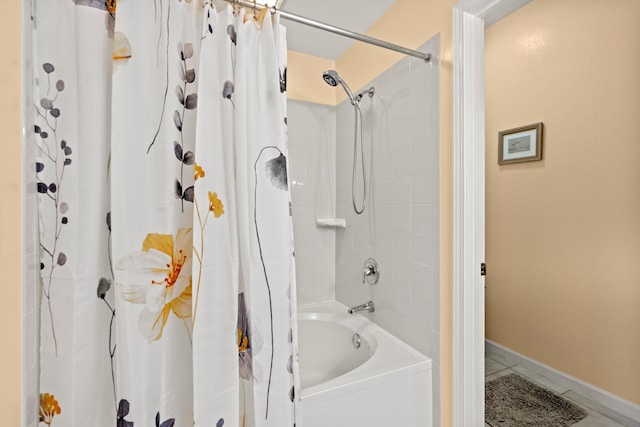 bathroom with baseboards, tile patterned flooring, and shower / bathtub combination with curtain