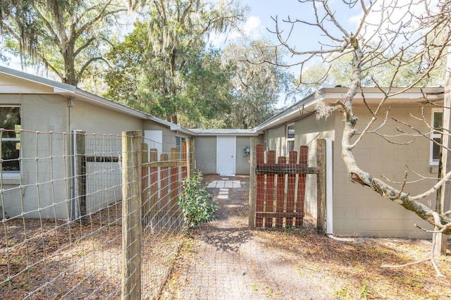 view of side of property featuring fence