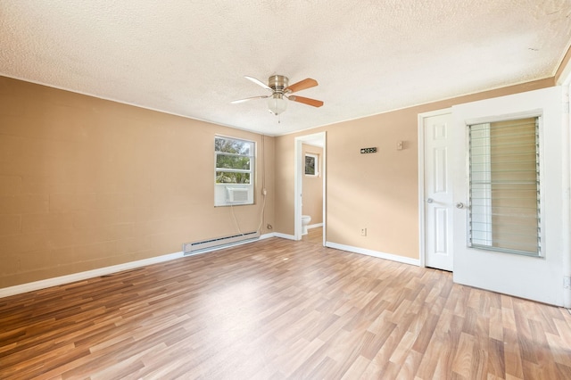 empty room featuring a baseboard heating unit, light wood finished floors, a textured ceiling, and a ceiling fan