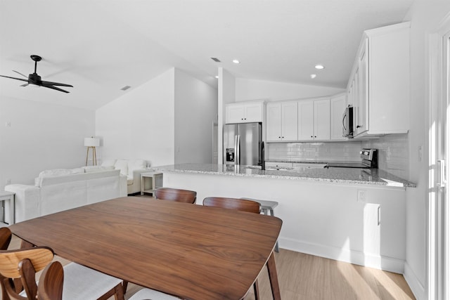 241 Jackson Blvd, Saint Augustine, FL 32095 - dining space featuring light wood finished floors, lofted ceiling, recessed lighting, and a ceiling fan