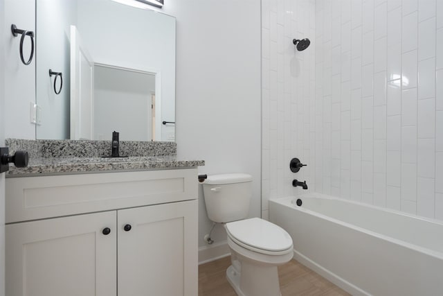 241 Jackson Blvd, Saint Augustine, FL 32095 - bathroom featuring washtub / shower combination, baseboards, toilet, wood finished floors, and vanity