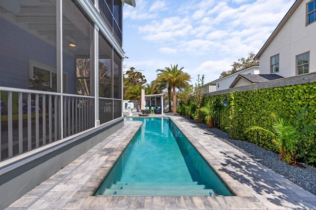 view of swimming pool with a patio area, a fenced backyard, and a fenced in pool