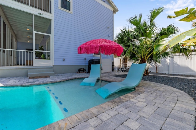 view of swimming pool with a fenced in pool, a patio area, and a fenced backyard