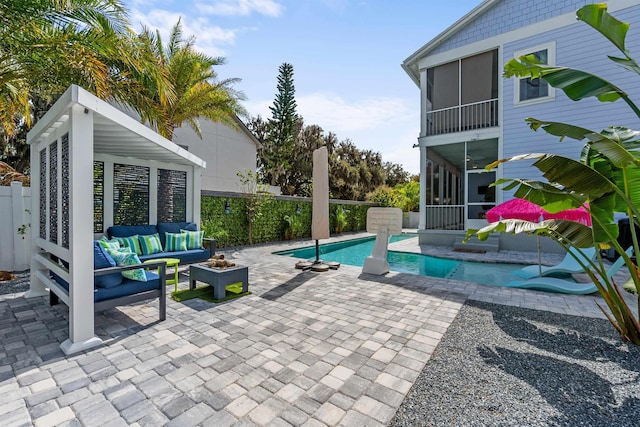 view of pool with a fenced in pool, a sunroom, a fenced backyard, an outdoor hangout area, and a patio area