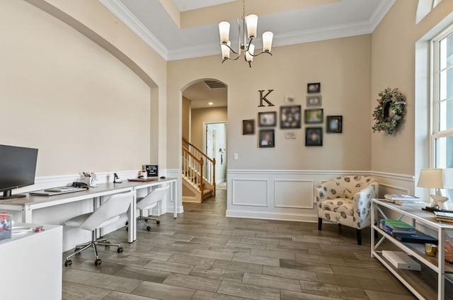 home office with crown molding, a chandelier, and a tray ceiling