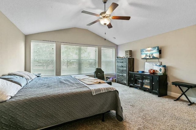 carpeted bedroom featuring vaulted ceiling and ceiling fan