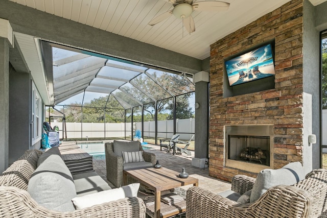 view of patio with a fenced in pool and an outdoor living space with a fireplace