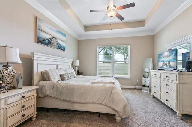 carpeted bedroom featuring crown molding, ceiling fan, and a tray ceiling