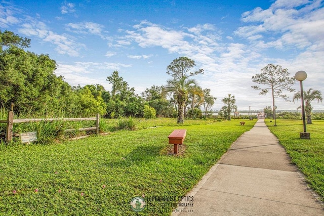 view of property's community with a yard